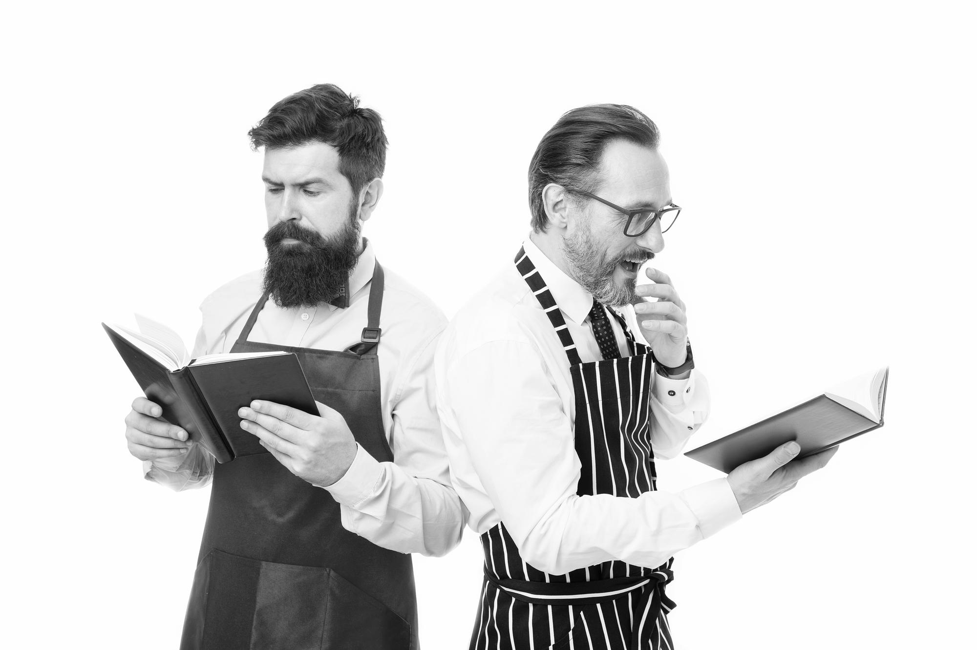 Chef meeting client with portfolio and menu samples